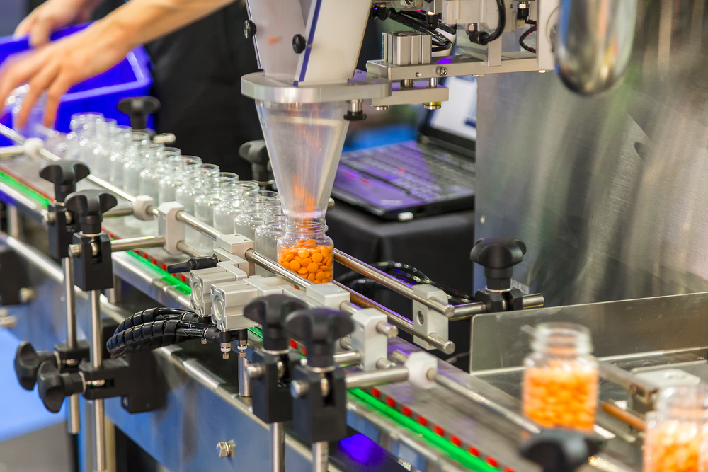 Pharmaceutical robotics - showing bottles being filled with pills