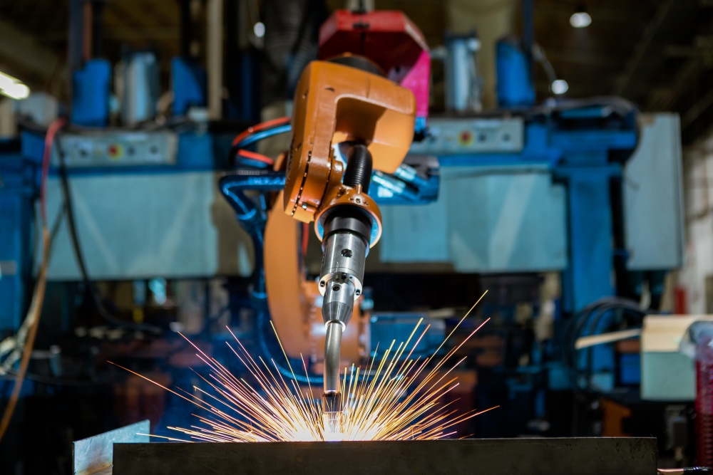 Robotic welding in process, with sparks flying