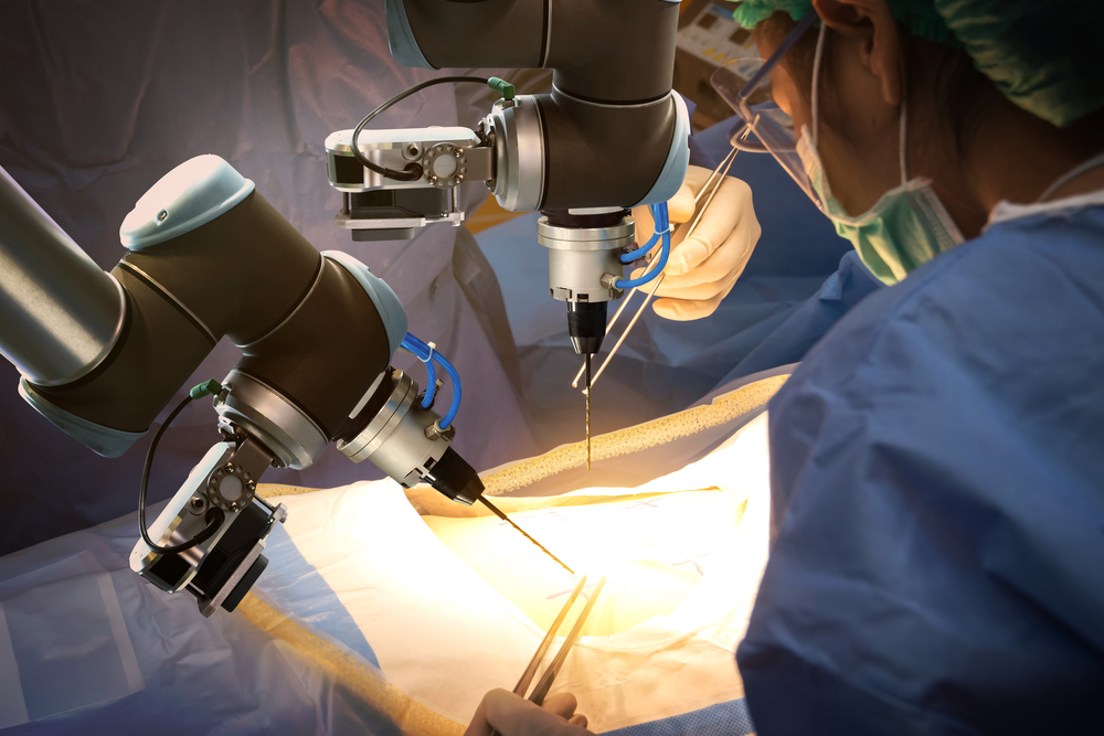 A surgical robot being operated by a doctor. Robot arms hold needles or drills. Surgical garb, surgical gloves.